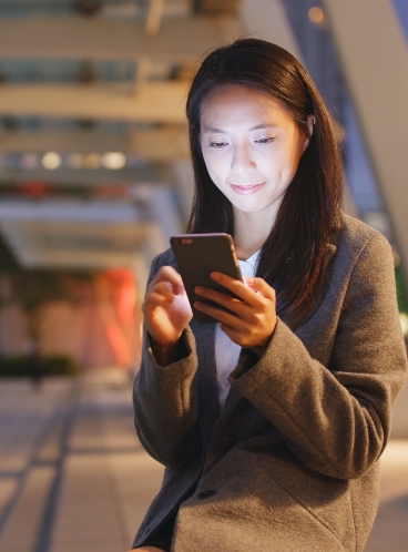 Woman using her cell phone Woman using her cell phone